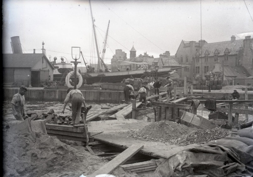Men at work constructing quay