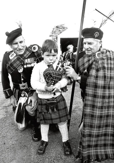 1962: Alex Duncan, of Glasgow, toasts the Wallaces of Candacraig in front of Candacraig House.