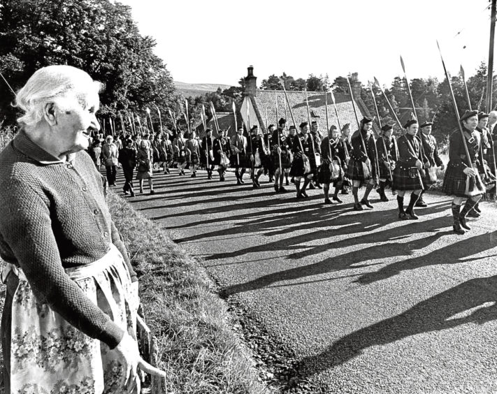 1973: Col Sir John Forbes raises his glass to toast the Wallace family at Candacraig joined by the Wallace marchers.