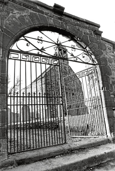 1976: The picturesque gateway to the Old Kirk of Turriff, with its double bellcote.