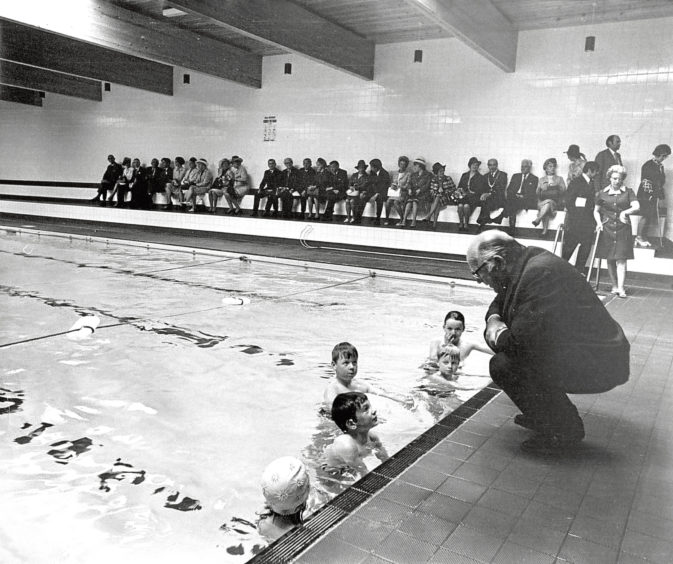 1973: Maitland Mackie talks to four young swimmers at the opening of Turriff swimming pool.