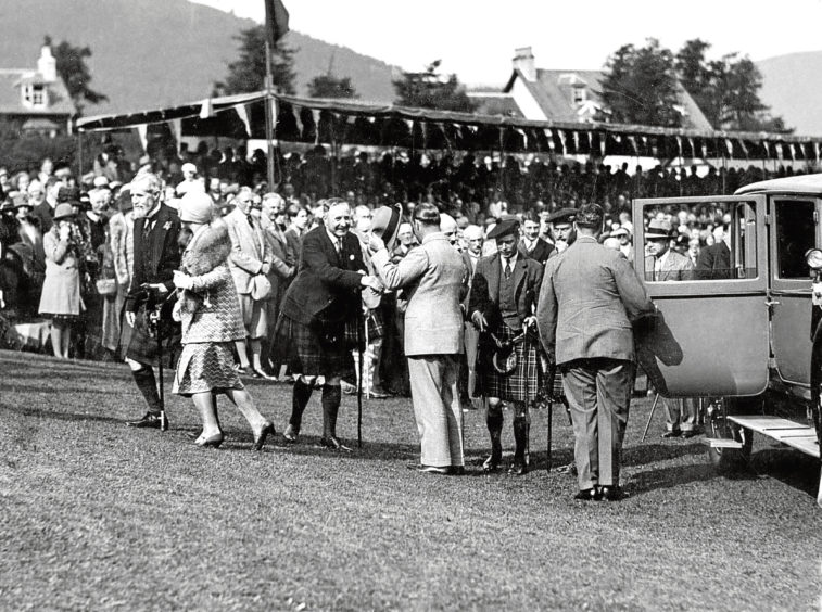 1929: The Duke and Duchess of York arrive at the Gathering with the Duke of Gloucester.