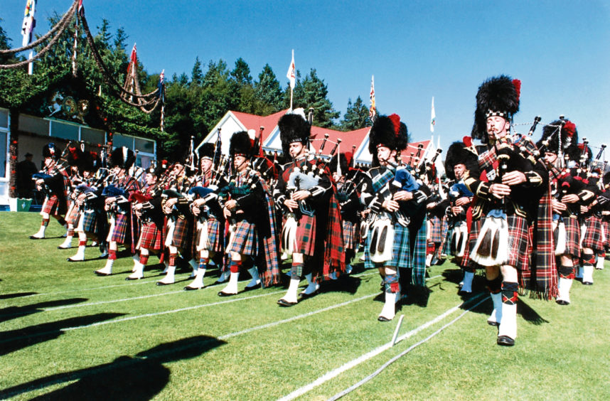 1991: The spectacular massed pipe bands march past the Royal Pavilion.