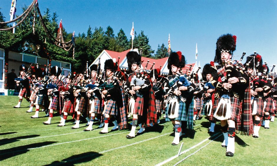 1991: The spectacular massed pipe bands march past the Royal Pavilion.