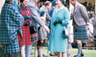 1969: The Royal party are greeted by guests at the Royal Pavilion at the Gathering.