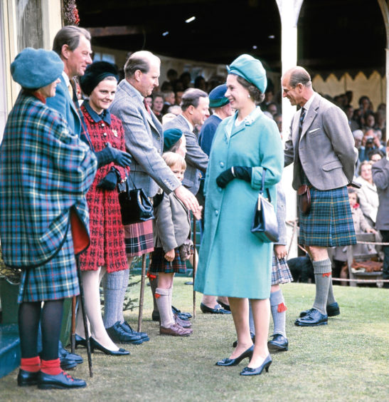 1969: The Royal party are greeted by guests at the Royal Pavilion at the Gathering.