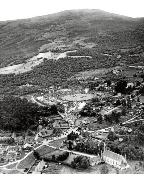 1949: An aerial shot showing the crowds heading for the Braemar Gathering.