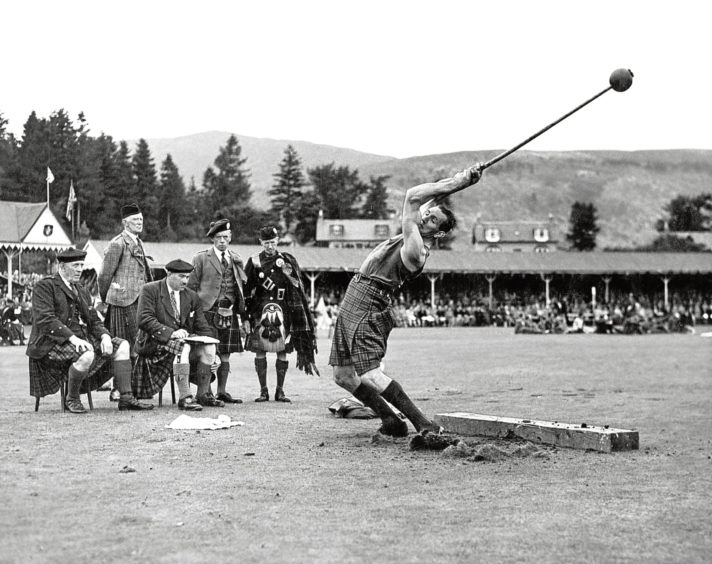 1948: The judges watching a hammer thrower in action at the Braemar Gathering.