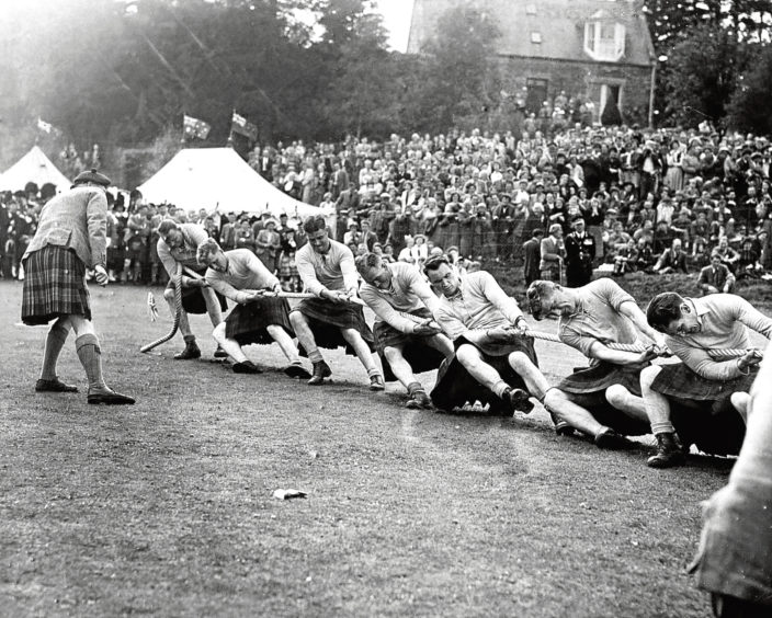 1956: The Cameron Highlanders’ Colonel in Chief watches the Gordons win the tug-of-war.