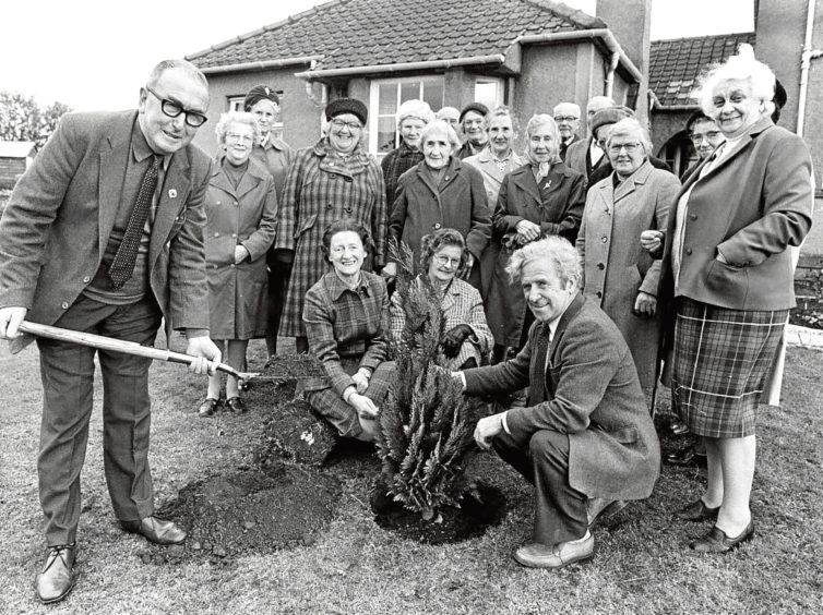1983: Members of Oldmeldrum Evergreen Club gather for a tree-planting ceremony at Slessor Place.