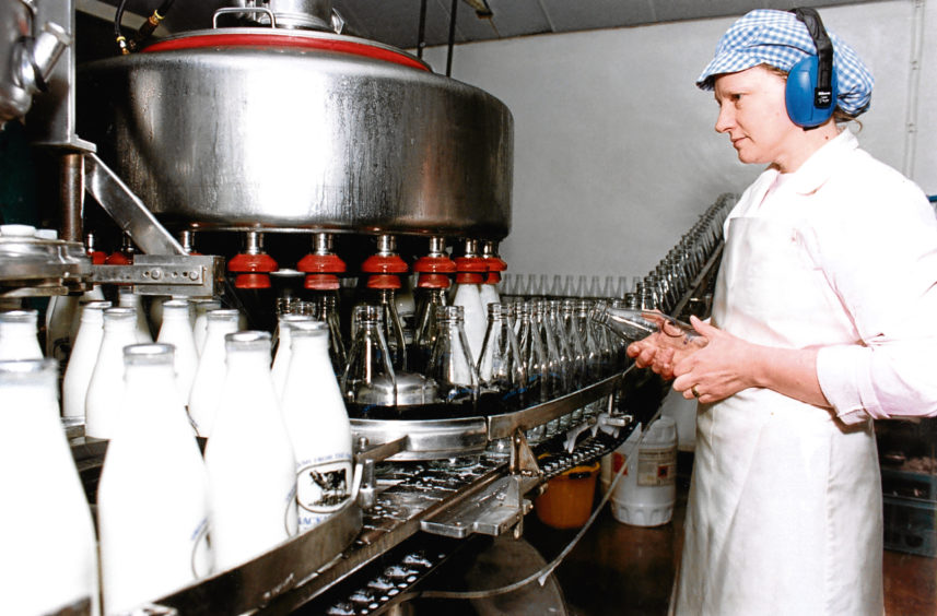 1992: Mackie’s process worker Shiela Diack keeps an eye on the daily pinta production.