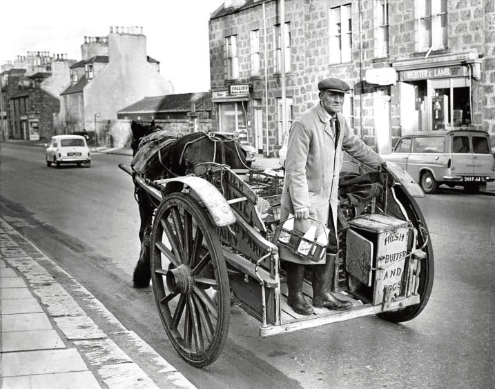 1969: Mr Hugh Will delivers milk to residents