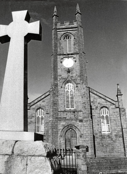 1970: New Deer Parish Church, St Kane's, with the war memorial in the foreground.