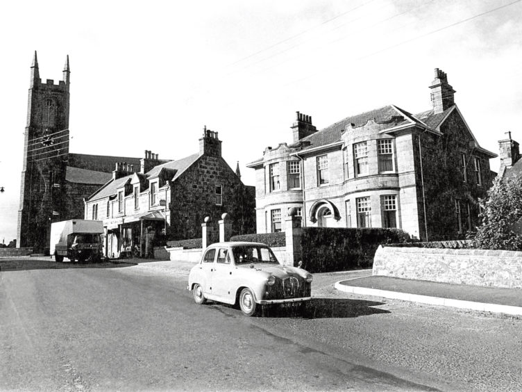 1970: A view from Fordyce Terrace along Church Crescent in New Deer showing St Kane's Church.