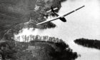 1979: A glider from the Deeside Gliding Club drifts slowly over Loch Kinord.