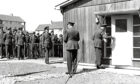1960: Group Captain Leach opens the door of the new headquarters at Dyce.