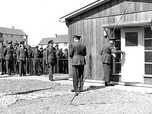 1960: Group Captain Leach opens the door of the new headquarters at Dyce.