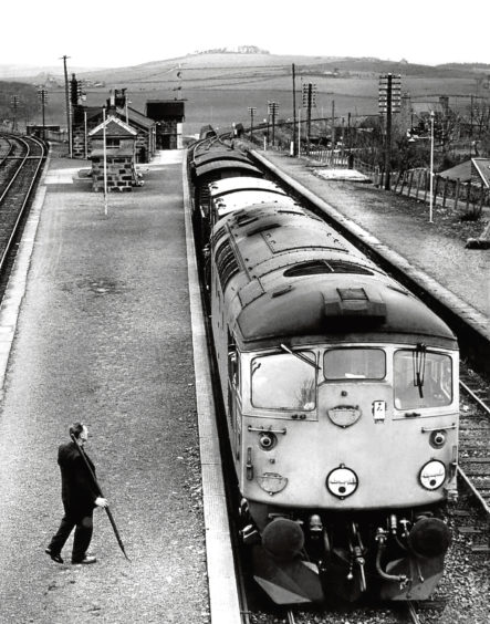 Maud Junction - once a busy junction. Jim Morrison, the only member of staff there now, prepares to attend the 12 noon Peterhead to Aberdeen goods train. On the left is the line to Fraserburgh.