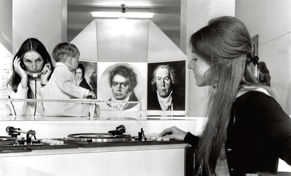 1970: Heather Clayton selects a recording from Beethoven’s works for visitors to the new-style exhibition