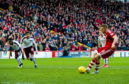 Aberdeen's Adam Rooney opens the scoring from the penalty spot.