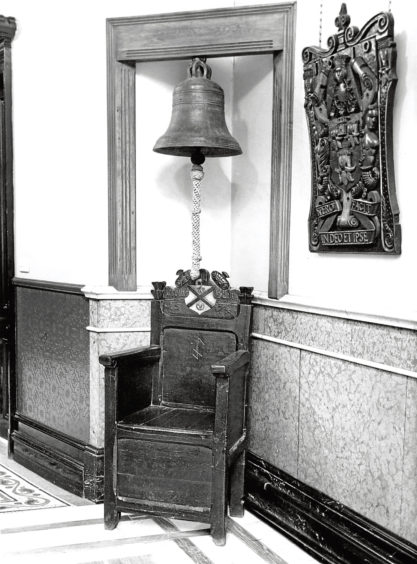 1964: The ancient bell of Trinity Hall used to call members of the crafts to meetings and meals.