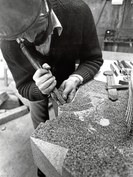 1975: Bill Elsey of A & J Robertson Ltd, Merkland Road, puts the final touches to a headstone
