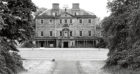 1961: An exterior view of the front entrance and gardens of Haddo House as seen in 1961.