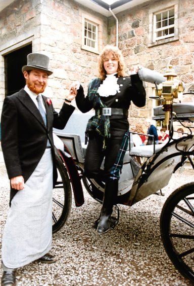 1991: A touch of old-fashioned courtesy, as John Crawford, manager of Hayfield Riding Centre, Aberdeen, helps instructress Jackie Taig, from Aberdeen, out of the carriage at Haddo House.