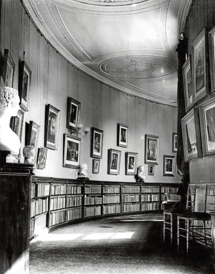 1948: The book-lined passage on the northwest wing leading to the library and chapel at Haddo House.
