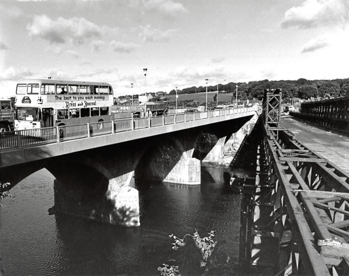 1984: The recently reopened Persley Bridge, left. On the right is the temporary Bailey Bridge, which was to be dismantled.