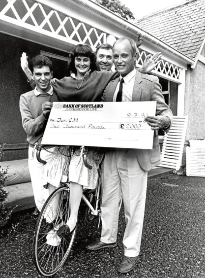 1990: Friends of Torphins Community Hospital with a cheque for £2,000 after a sponsored cycle.