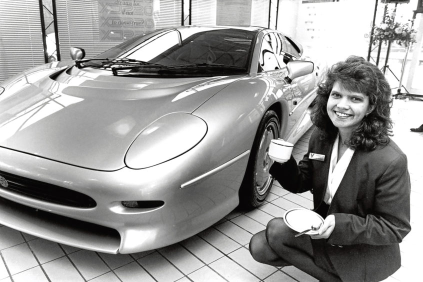 1992: Reg Vardy receptionist Susan Rennie checks out a Jaguar XJ220.