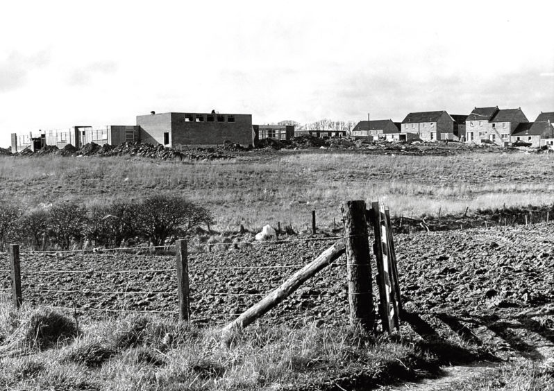 1975: A new council housing development taking shape. On the left is the new Community Centre and Primary School.