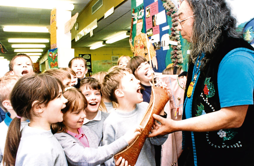 1995: Youngsters at Balmedie Primary School are shown a model of an Indian canoe by Jim Northrup.