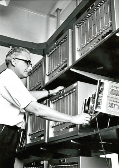 Mr K Foster checks the signal strength of messages coming from the oil rigs by the radio teleprinter service in October 1971.