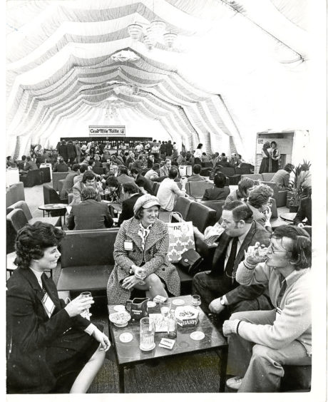 1975: some visitors taking it easy at the Oil Offshore exhibition.