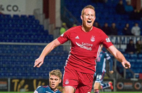 Adam Rooney celebrates a goal for Aberdeen