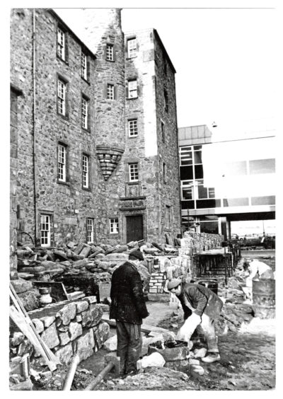 "An ancient archway is being carefully re-built near its original site in Aberdeen's Guestrow, where it stood next to Provost Skene's House, now dwarfed by the city's new municipal building, St Nicholas House."