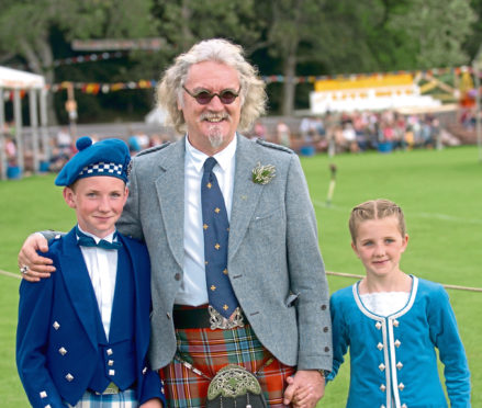 2006: Billy Connolly with young Highland dancers in Bellabeg Park, Strathdon