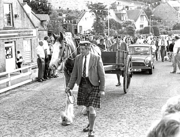 1990: Willie Gray leads Diamond the cart horse at the rear of the march through the Valley of Strathdon