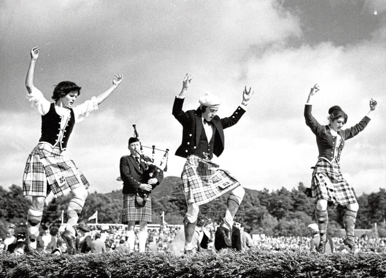 1977: Competitors show off their talents as they perform a Highland sword dance