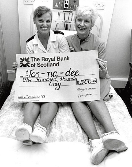 1988: Putting their feet up are Ruby Moir, left, and Joyce Gordon, two nurses from Tor-Na-Dee Hospital who raised £500 with a 23-mile walk