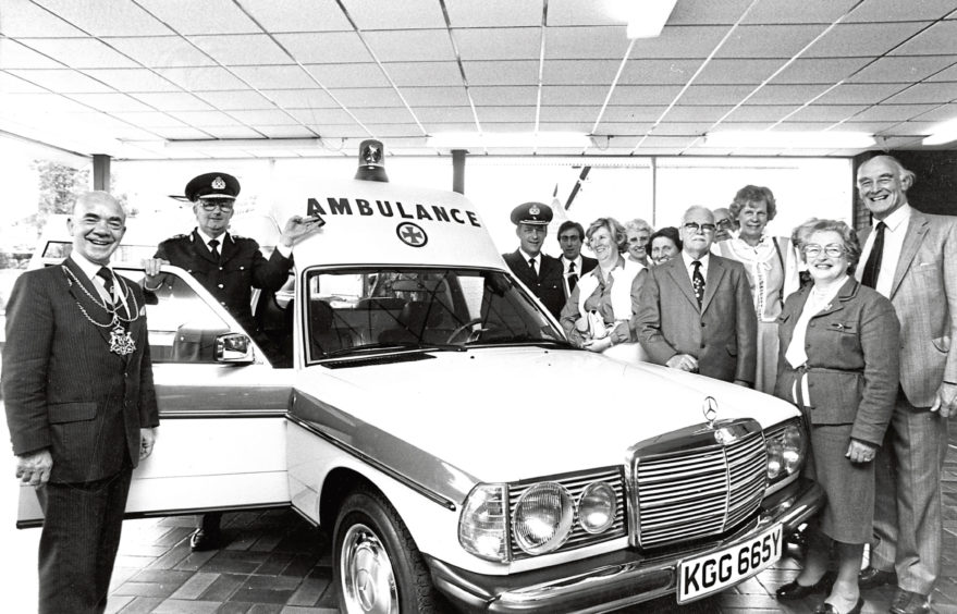1990: Chief ambulance officer George Gilchrist, second left, with the keys to the latest addition to the Aberdeen Ambulance Service’s fleet. The £22,000 for the ambulance was raised by the Roxburghe House Transport Fund