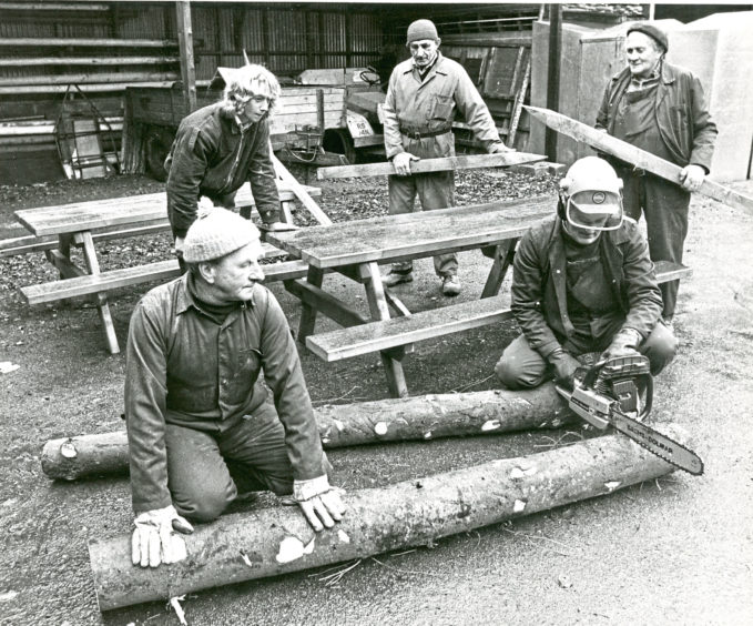 1980: Rear, from left, Jimmy Nicol, Donald Junor and James Strath and, kneeling, Harold Gray and Adam Cassle, with some of the fence posts and park furniture they’d made in the sawmill at Hazlehead Park