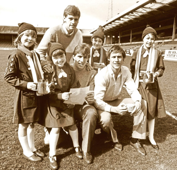 1984: The 3rd Bridge of Don Brownies served up tea for Dons players Eric Black, back, Mark McGhee, centre, and Doug Rougvie
