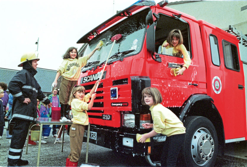 1995: Inverurie 5th and 6th Brownies had a splash washing the town’s fire engine in 1995 to raise money for Wateraid in Ethiopia and India