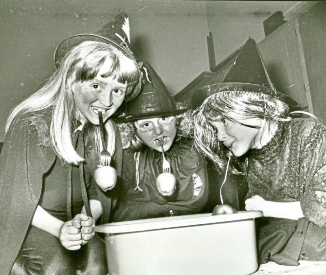 1985: Brownies Elizabeth Chapman, Lindsey Orchard and Claire Hunter  dook for apples during a Halloween party in Ferryhill South Church hall