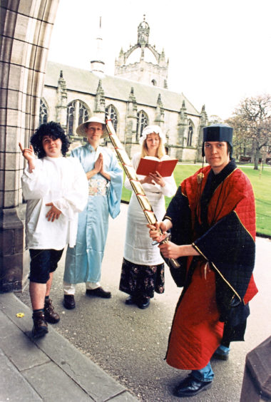 1996: Dressed in costumes from past shows are members of the Aberdeen University Gilbert and Sullivan Society