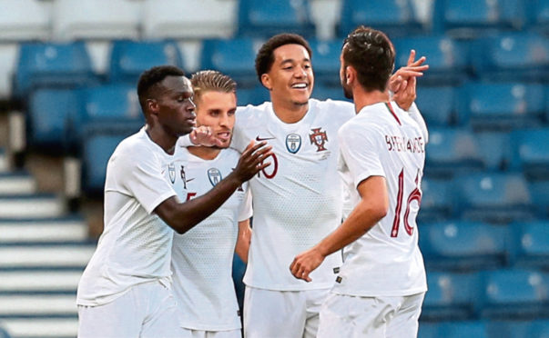 Portugal's Helder Costa, second right, celebrates scoring his side's first goal of the game during the International Friendly match at Hampden Park, Glasgow.