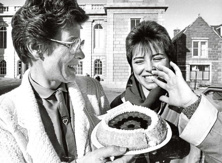 1986: Inverurie SWRI member Margaret Massie, left, watches as daughter Linda steals a taste of her fruit flan